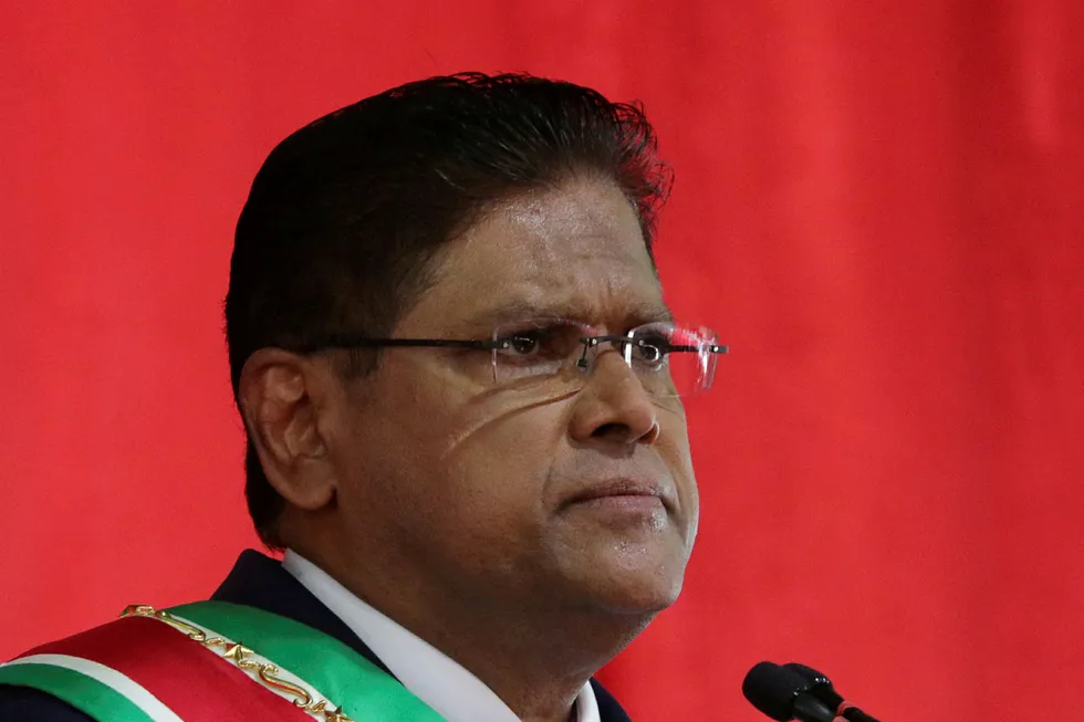 Transition: Suriname's President Parasad Santokhi addresses an audience after receiving the presidential sash from outgoing President Desi Bouterse, in Paramaribo