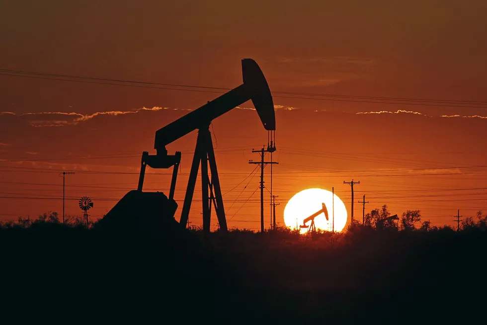 In this 11 June 2019 file photo, a pump jack operates in an oil field in the Permian Basin in Texas.