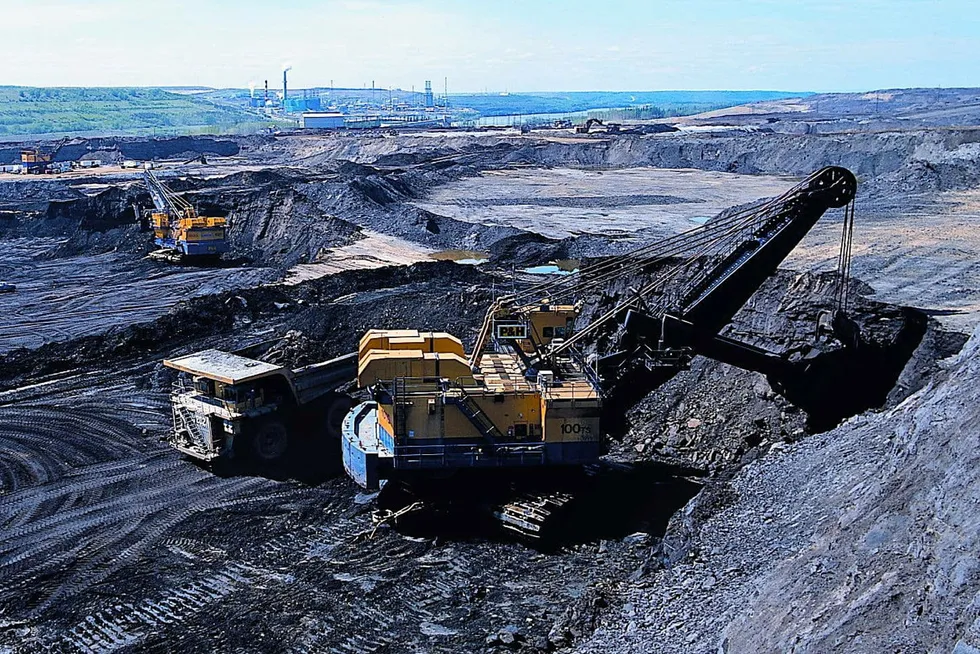 Jobs gone: Loading huge 240 to 380 tonne trucks using shovels with buckets at a Suncor oil sands mine in Alberta, Canada.