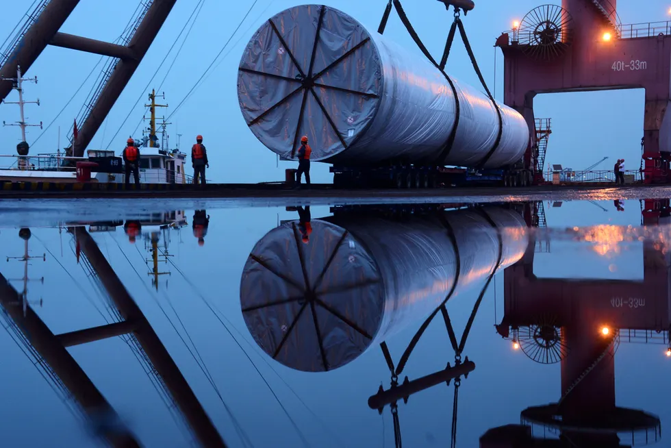 Support: a crane lifts offshore wind equipment in Nanjing, Jiangsu province