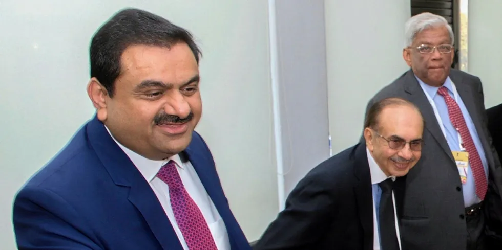 Gautam Adani (left) is a leading billionaire backer of green energy