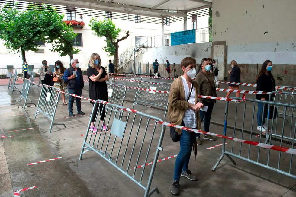 Basque aid: people wearing face masks queue to vote at a polling station in the northern Spanish Basque city of Ordizia during the Basque regional elections on July 12, 2020