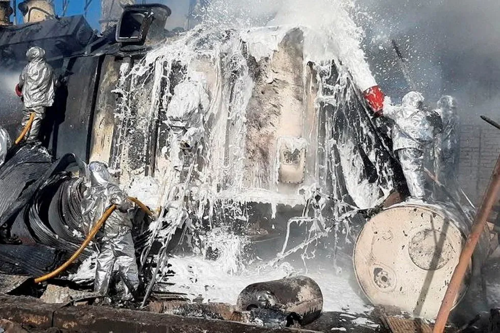 Wreckage: Firefighters survey energy infrastructure facilities damaged by a Russian missile strike in Zhytomyr, Ukraine