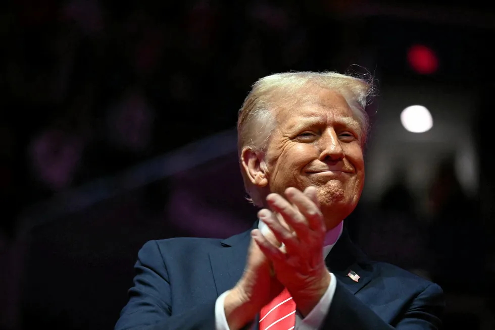 Donald Trump reacts during a MAGA victory rally at Capital One Arena in Washington, DC, on January 19, 2025, one day ahead of his inauguration ceremony.