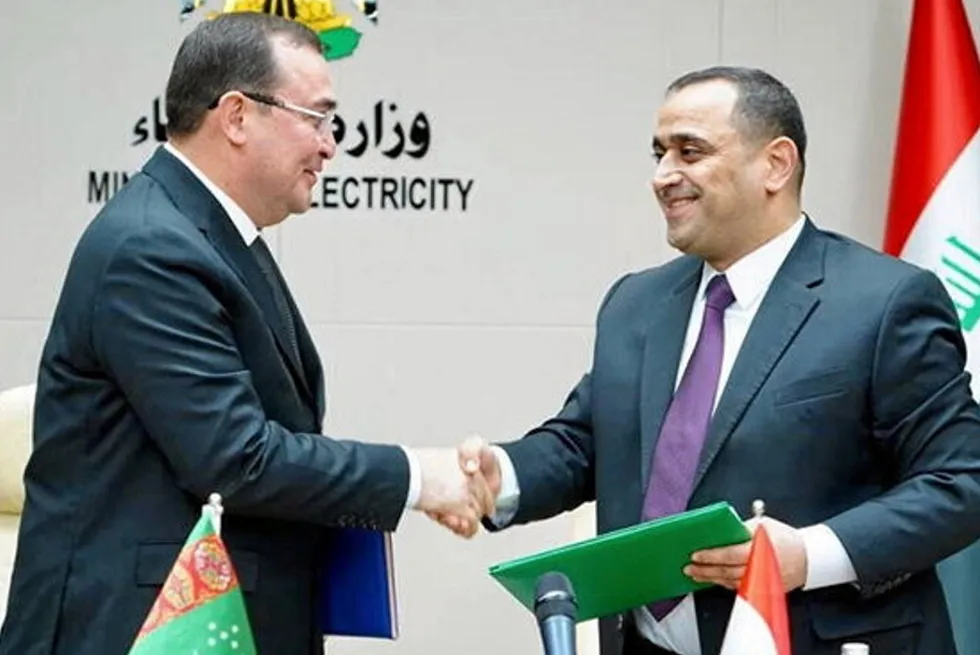 Turkmengaz executive chairman Maksat Babayev (left) and Iraqi Electricity Minister Ziad Ali Fadel (right).