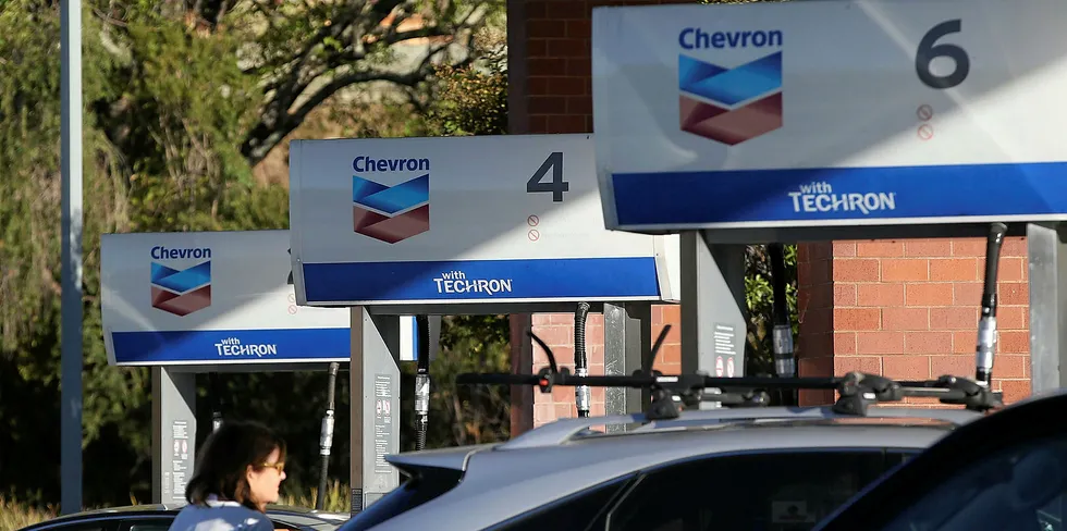 The Chevron logo is displayed at a Chevron station in Greenbrae, California.