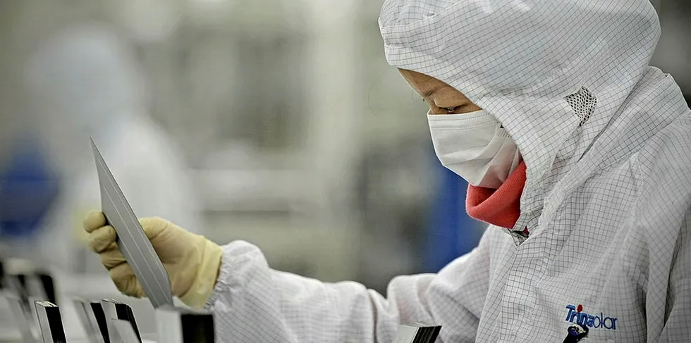 A Trina Solar worker in Changzhou: Chinese firms have led the way in scale production of PV.