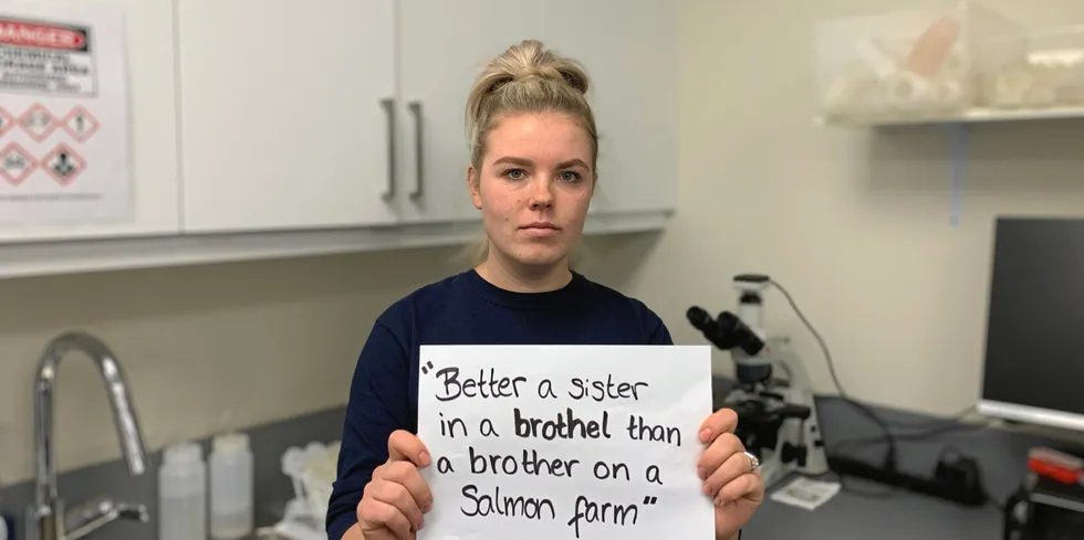 Kirstyn Nygren, environmental specialist at Grieg Seafood BC holds up the quote of an online commentator.