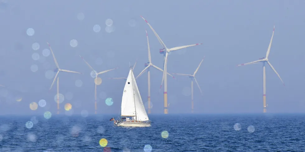 A yacht sails past wind turbines at the Arkona wind park in the Baltic Sea, off northern Germany.