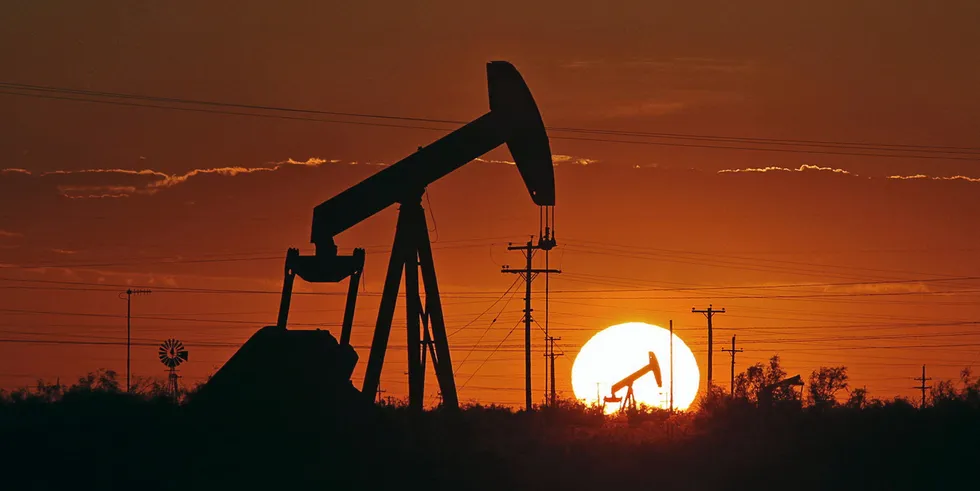 Pump jack operates in an oil field in Texas