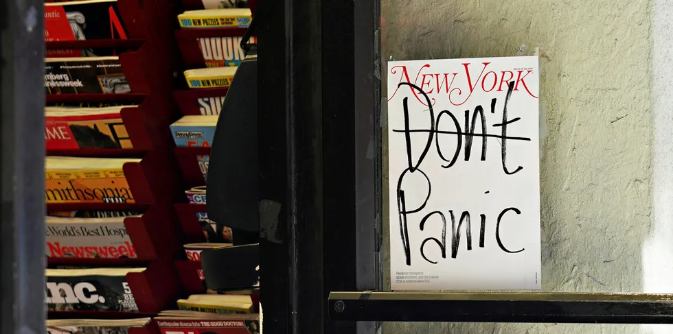 A New York Magazine cover reading 'Don't Panic' is displayed on the door of a magazine shop as the coronavirus continues to spread across the United States on March 15, 2020 in New York City.