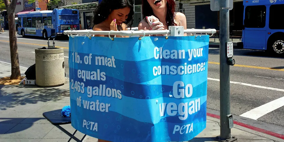 PETA protestors, "go vegan."