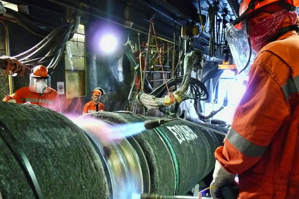 Workers onboard Saipem pipelay vessel Castoro Sei laying Nord Stream pipeline Sept 2011