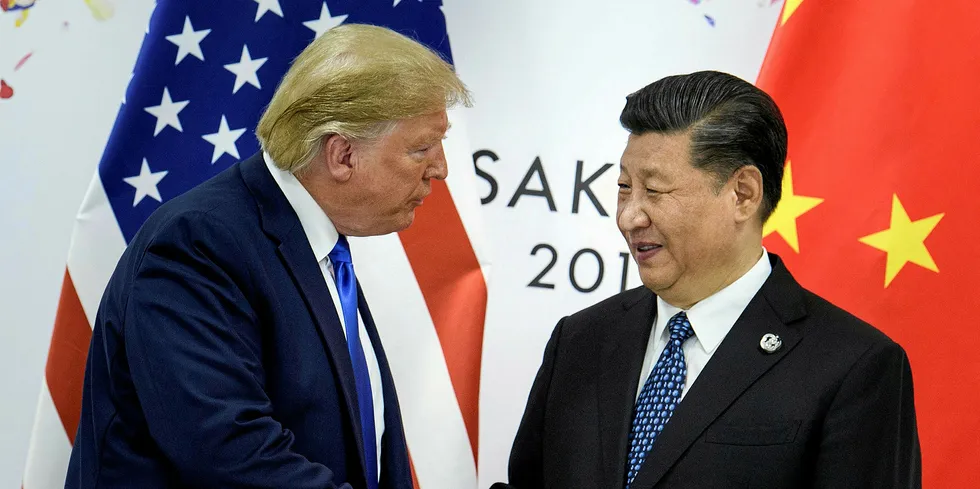 In this file photo taken on June 28, 2019, China's President Xi Jinping (R) shakes hands with US President Donald Trump before a bilateral meeting on the sidelines of the G20 Summit in Osaka.