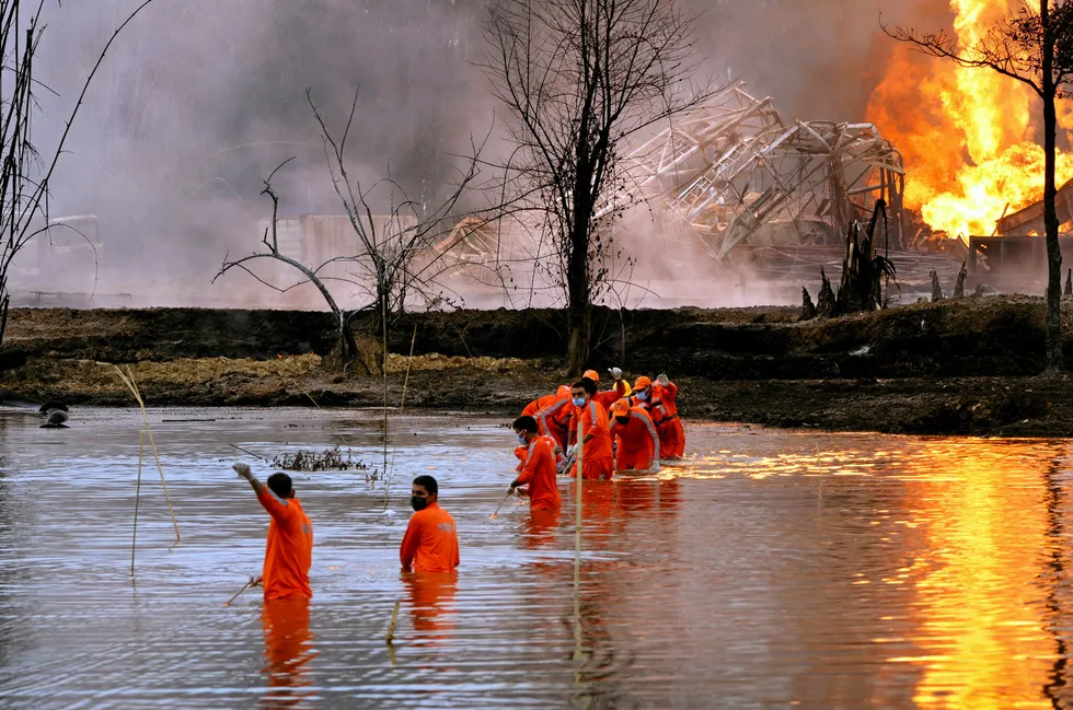 Rescue operation: personnel from India's National Disaster Response Force in the aftermath of the Baghjan blowout