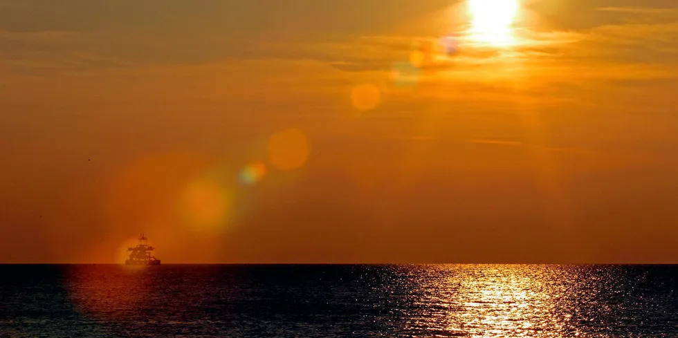 A sunset view of an floating oil platform along the Tirreno sea coast in front of the city of Civitavecchia, north of Rome, in 2011