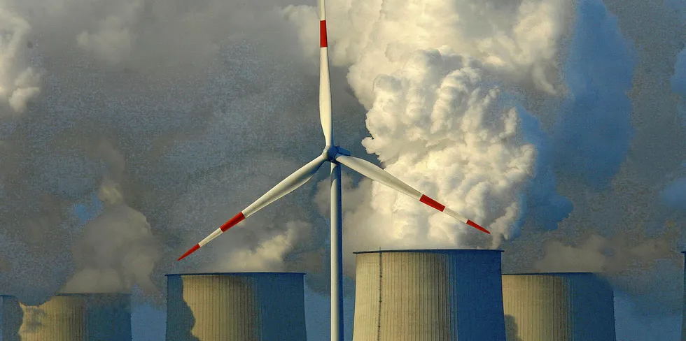 Wind turbine in front of the lignite-fired power plant in Jaenschwalde, Germany