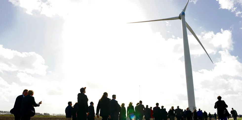 Happier days. Visitors gather at the commissioning ceremony for XEMC Darwind's XE115-5000 direct-drive 5MW turbine in 2012 in the Netherlands