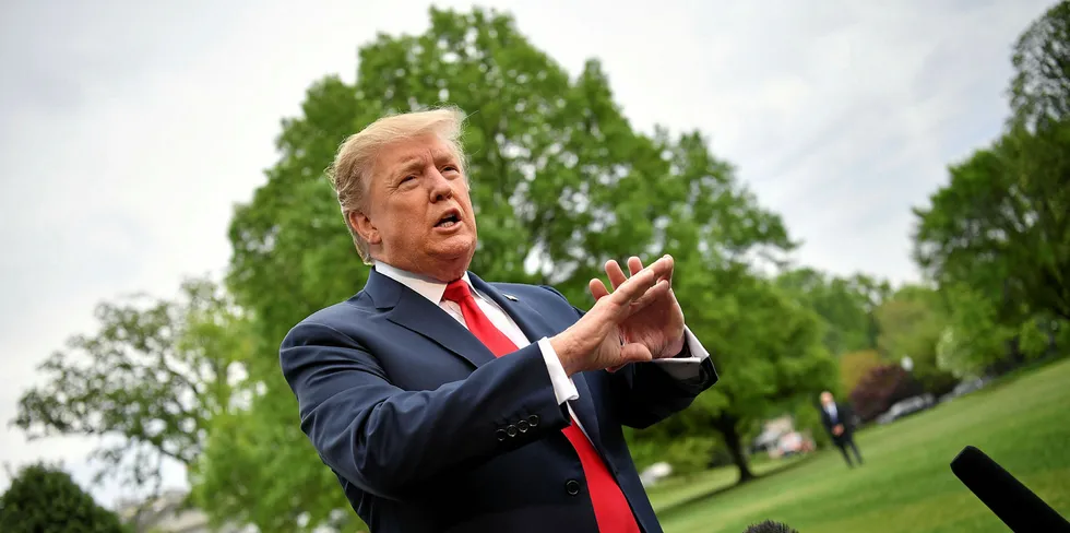US President Donald Trump speaks to reporters.