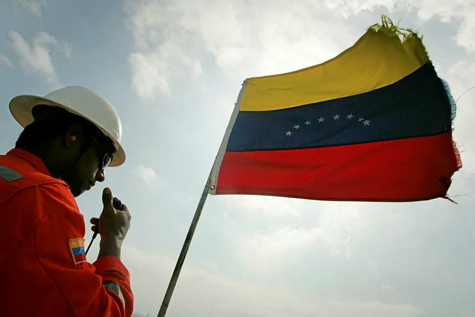 An oil worker takes a routine walk at the Urdaneta main production platform in the middle of Lake Maracaibo