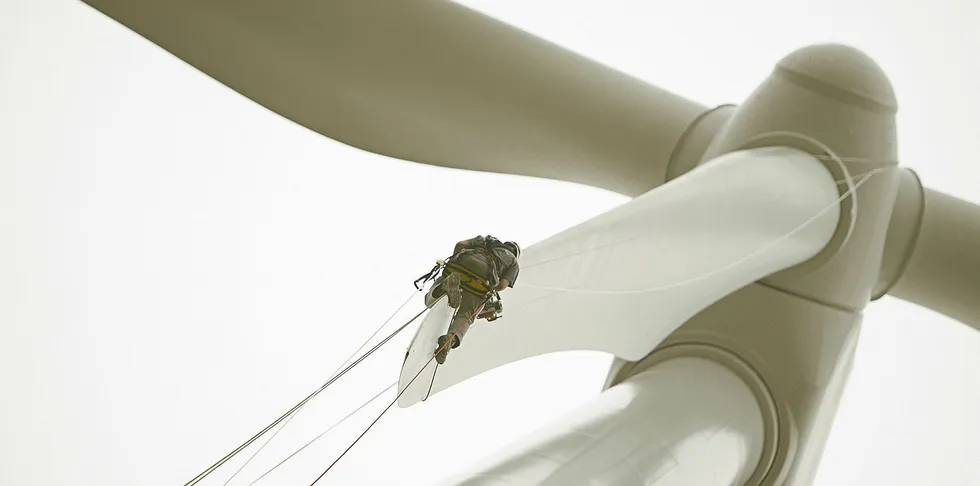 LM Wind Power service technician on blade tip at Brena wind farm, Spain