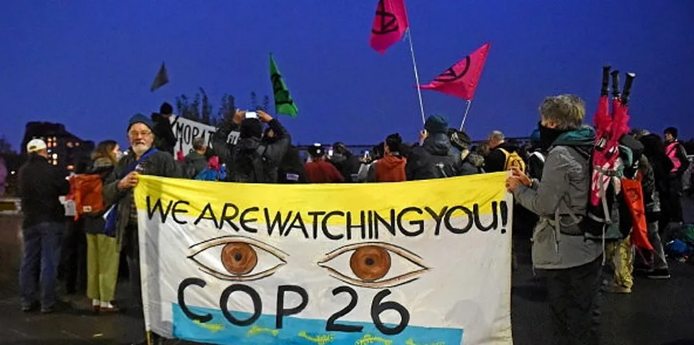 Protesters from the climate change group Extinction Rebellion demonstrate outside the venue of the COP26 conference in Glasgow, Scotland
