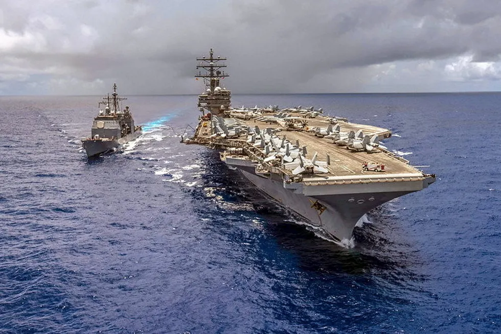 The guided-missile cruiser USS Antietam alongside the Navy's forward-deployed aircraft carrier USS Ronald Reagan.
