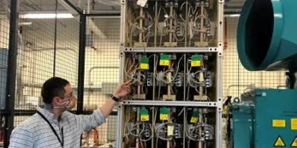 Nathaniel Hawes, principal engineer in the electrical systems group at GE Research, with the 'Tower of Power'