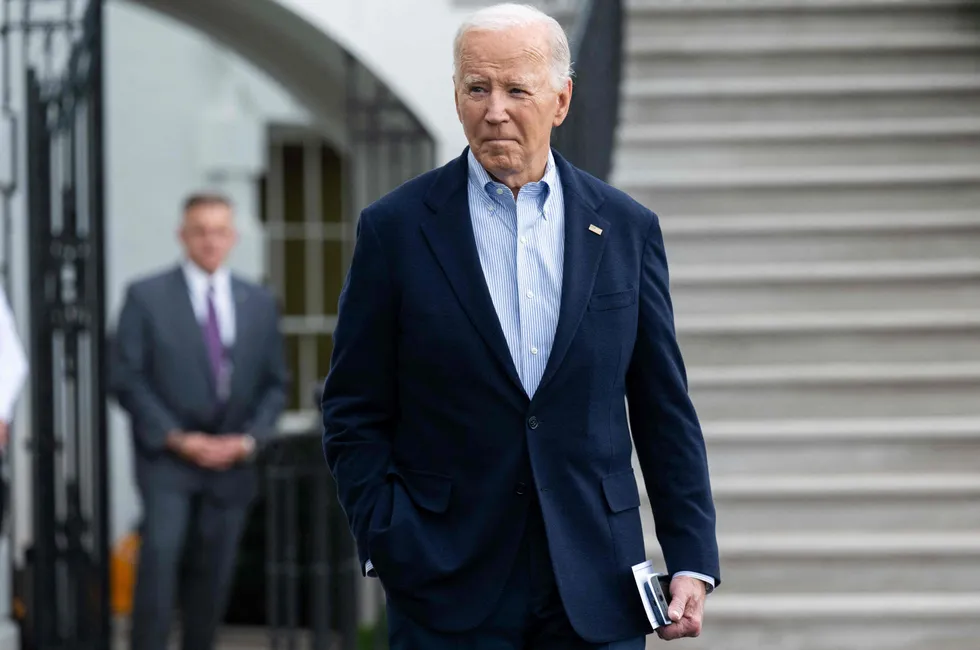 US President Joe Biden speaks to the media prior to departing on Marine One from the White House in Washington, DC, on October 3, 2024.