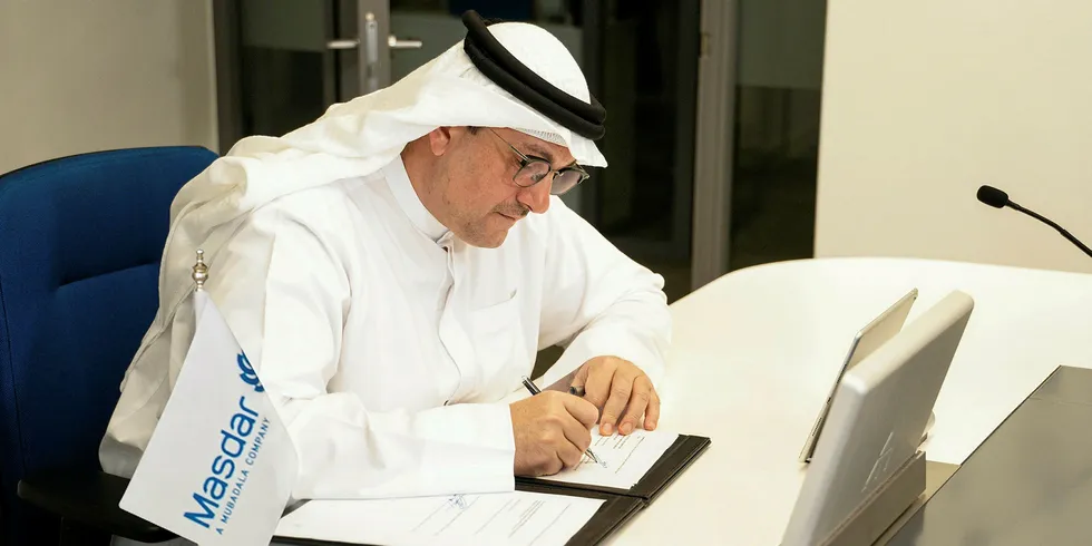 Masdar chief executive Mohamed Jameel Al Ramahi signing the agreement with Uzbekistan
