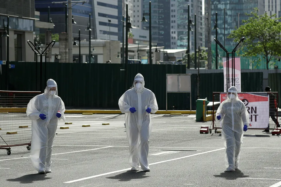 Cases rising: health workers conduct Covid-19 drive-through testing in Taguig, Metro Manila in the Philippines
