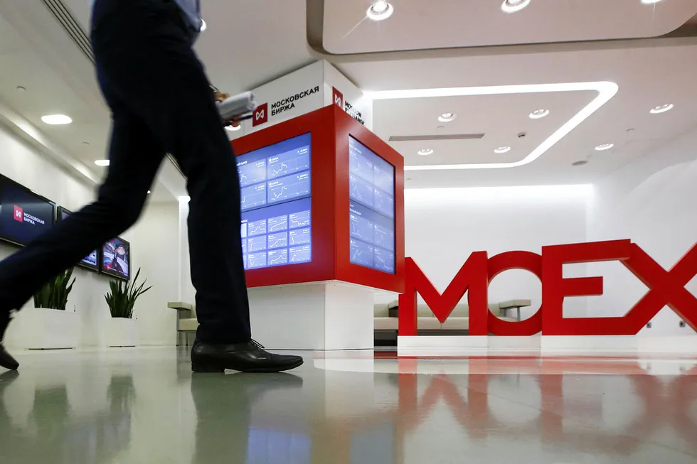 Losing value: a man walks inside the Moscow Exchange in Russia