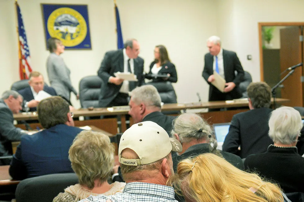 Diana Steskal rests her head on her husband Byron's shoulder as Nebraska Public Service Commissioners rise to leave following their vote approving the TransCanada's Keystone XL pipeline "mainline alternative route" through the state Monday, Nov. 20, 2017, in Lincoln, Neb. The couple are landowners in the path of the pipeline. (Eric Gregory/The Journal-Star via AP)