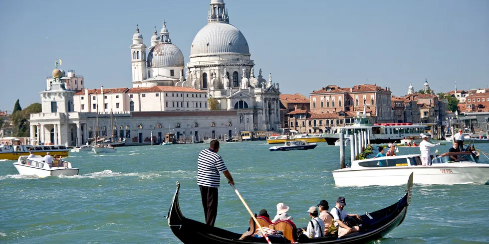 Despite being surrounded by the sea, or built in it, Italy has no wind turbine in the water yet. Photo of venice gondolas