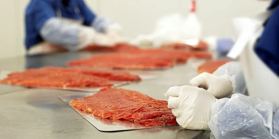 Processing smoked salmon.