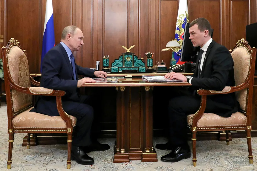 Head to head: Khabarovsk Regional Governor Mikhail Degtyaryov (right) speaks to Russian President Vladimir Putin at the Kremlin