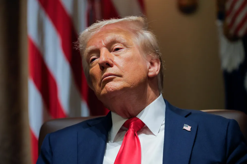 US President Donald Trump listens during a Cabinet meeting at the White House in Washington, DC, on Tuesday.