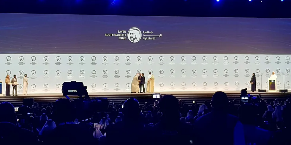 Electricians Without Borders is presented with the Zayed Sustainability Prize by the Crown Prince of Abu Dhabi, Mohammed bin Zayed Al Nahyan.