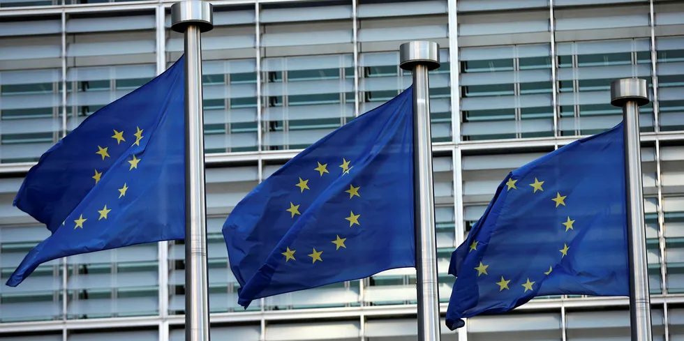 EU flags fly outside the European Commission headquarters building ahead of the EU-Turkey Summit on March 17, 2016 in Brussels, Belgium.