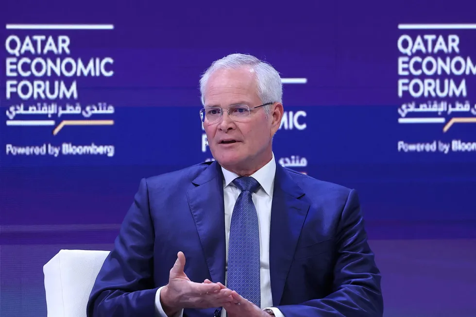 ExxonMobil chief executive Darren Woods gestures as he speaks during a session at the Qatar Economic Forum in Doha on 15 May 2024.