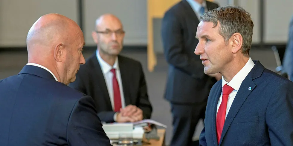 The FDP's Thomas Kemmerich shaking hands with far-right AfD leader Björn Höcke after being elected state premier of Thuringia