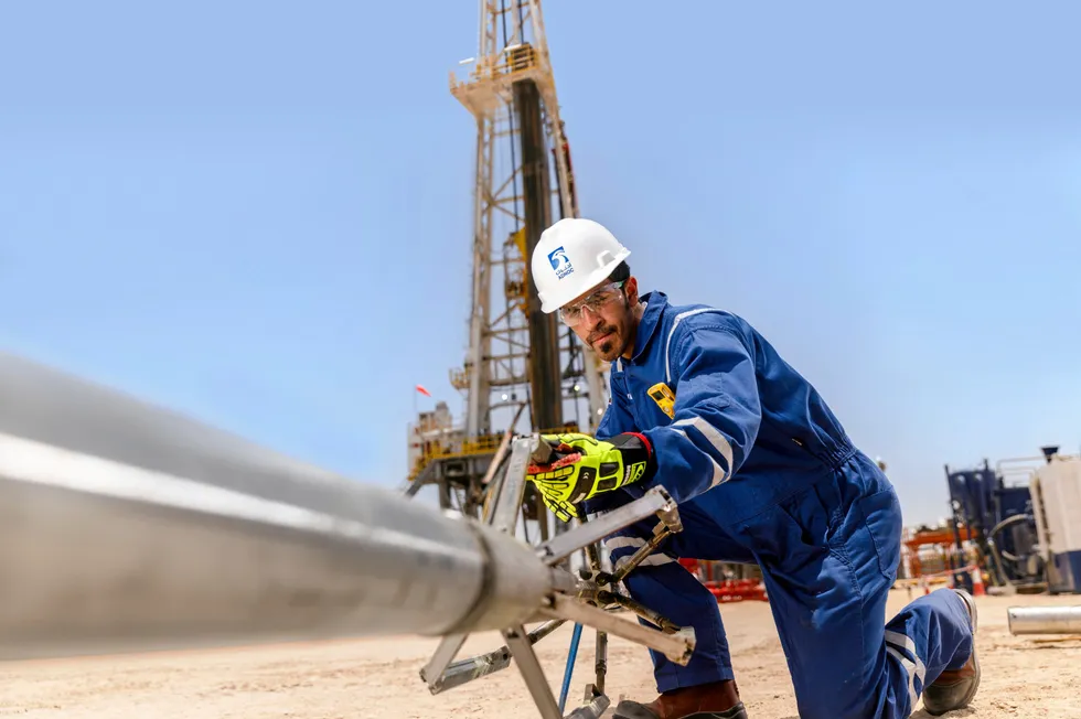 An Adnoc drilling worker at a wireline truck in Abu Dhabi.