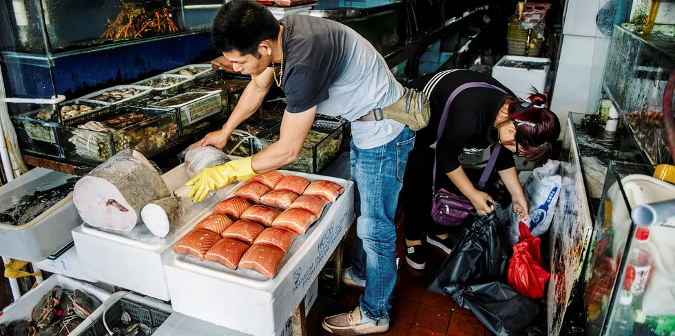 Fresh salmon fillet portions in a Shanghai market. The latest COVID-19 outbreak in China has been linked to a seafood market, including a cutting board used to process salmon.