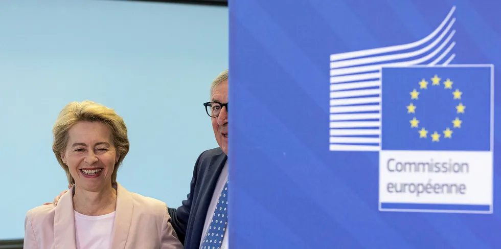 Nominee President of the EU Commission Ursula von der Leyen (L) is welcomes by the outgoing President of the European Commission Jean-Claude Juncker.