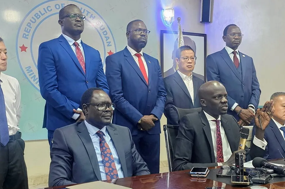 Puot Kang Chol, South Sudan's Minister of Petroleum (bottom row, centre), discusses the restart of oil production in Juba.