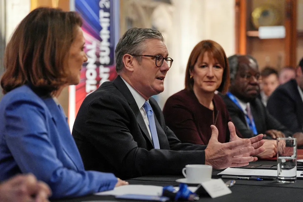 Britain's Prime Minister Keir Starmer chairs a meeting during the International Investment Summit, held at The Guildhall, in central London, on October 14, 2024.