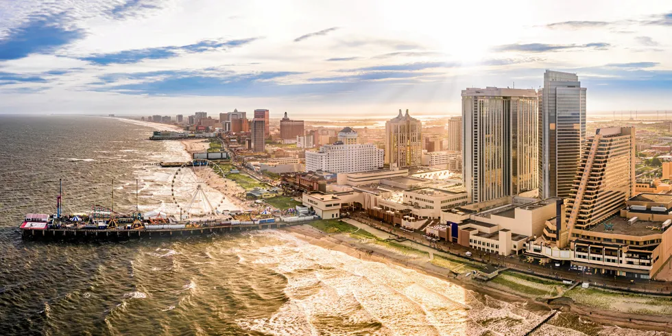 Late afternoon aerial panorama of Atlantic city along the boardwalk. Atlantic City achieved nationwide attention as a gambling resort and currently has nine large casinos. . New Jersey.