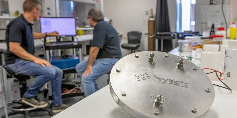 A Hysata capillary-fed electrolysis cell, with CEO Paul Barrett and CTO Gerry Swiegers in the background.