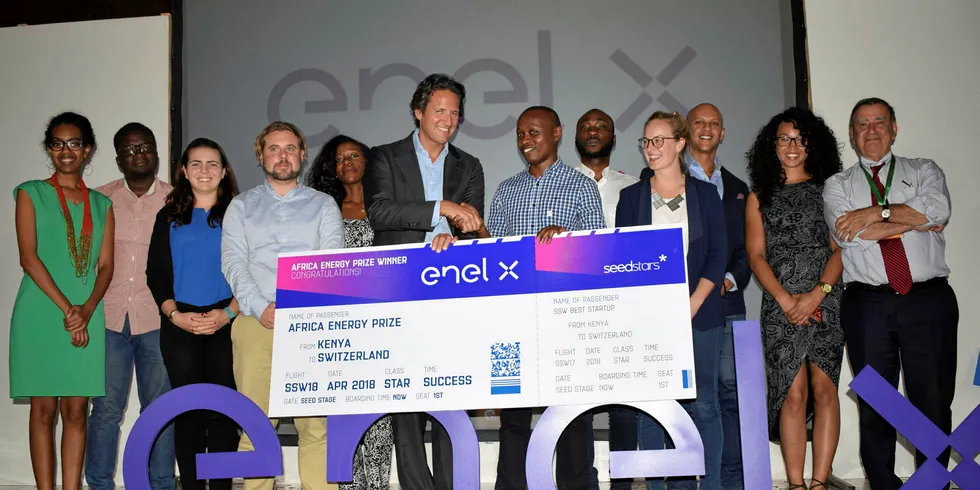 Enel X head of innovation and product Riccardo Amoroso (sixth from left) and Dysmus Kisilu (seventh from left) from SolarFreeze, along with others from SolarFreeze and Seedstars.