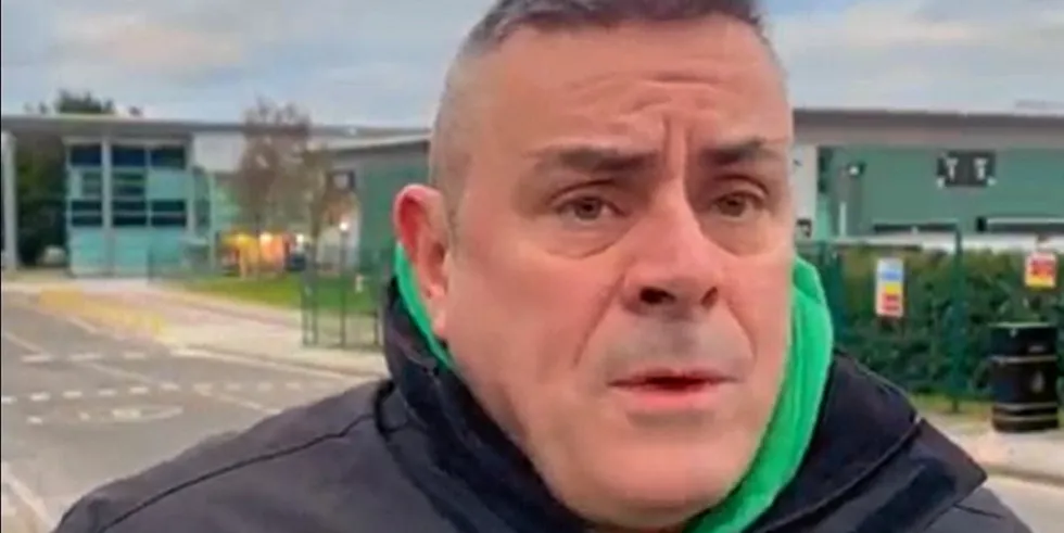 Mark McHugh, Regional Officer with Bakers Food & Allied Workers Union (BFAWU) outside salmon farmer Mowi's processing plant in Rosyth, Scotland.